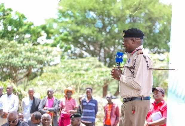 A Kenya Forest Service officer giving a community awareness talk at an ASREP Africa conservation event