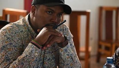 An ASREP Africa field staff member in an Isiolo County community, wearing an ASREP cap