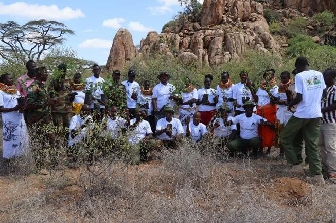 Community members planting trees among rocks in the ASAL landscape of Northern Kenya